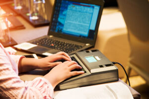 Court reporter transcribing trial proceedings for the accurate record in San Jose, CA